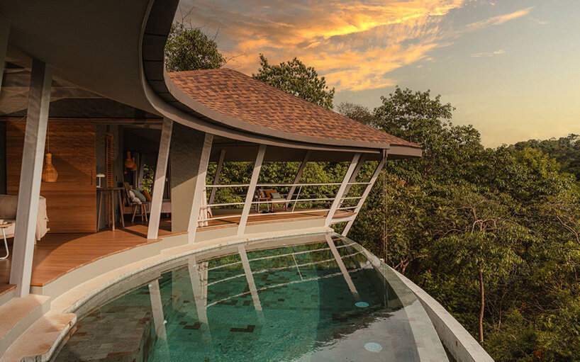 the pool edge aligns with the roof’s curvature