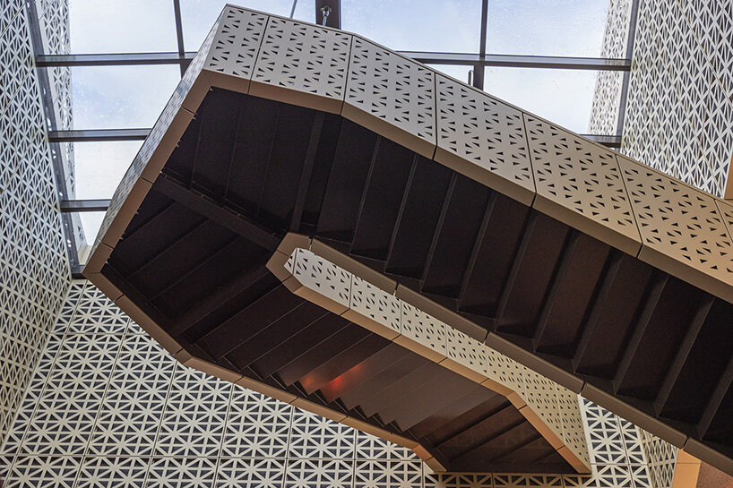 the underside of the suspended stair reveals its angular geometry