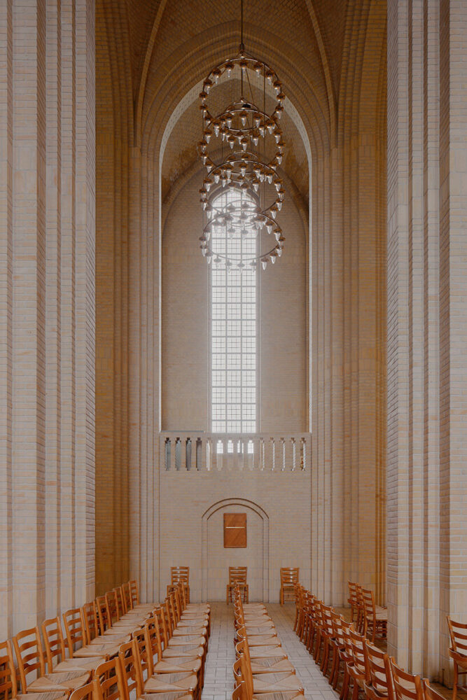 light enters through tall vertical glazing