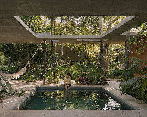 equipo de arquitectura organizes compressed earth house around native trees in paraguay