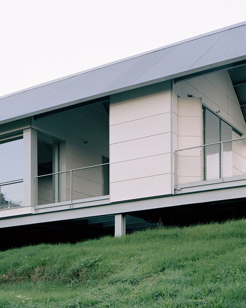 the corrugated metal roof completes a coherent envelope designed for thermal performance