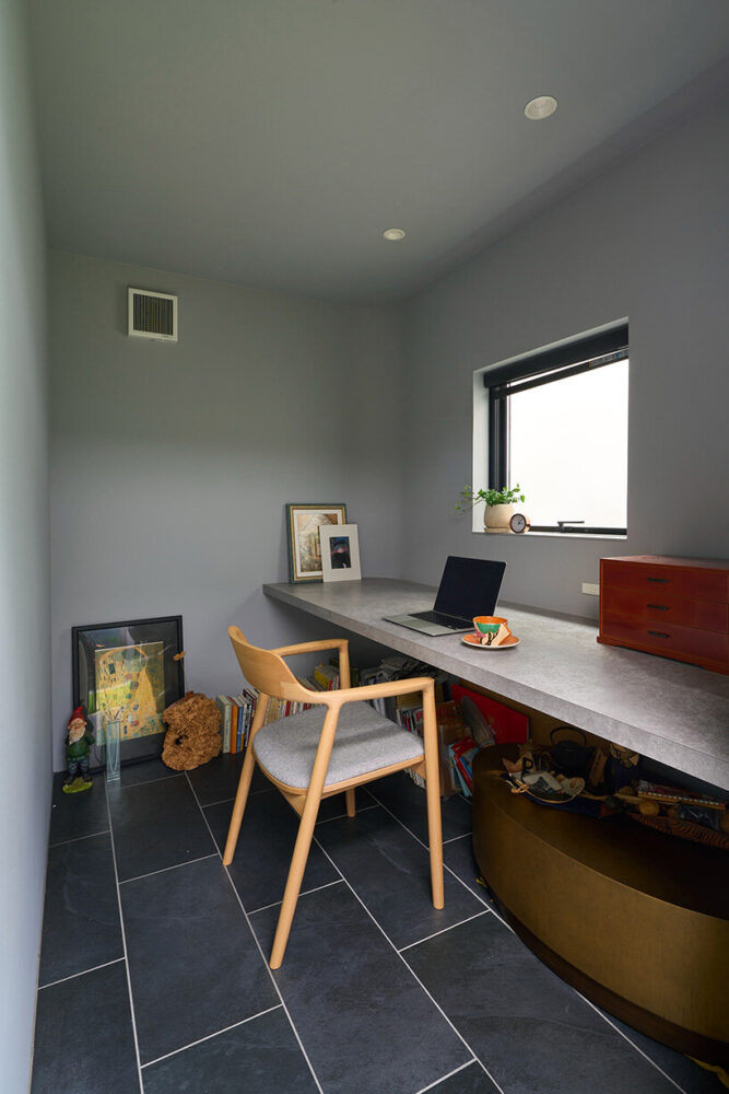 a booth-like study is positioned as a detached workspace