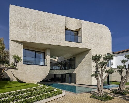 curved arches stack together for central courtyard villa by nextoffice in iran