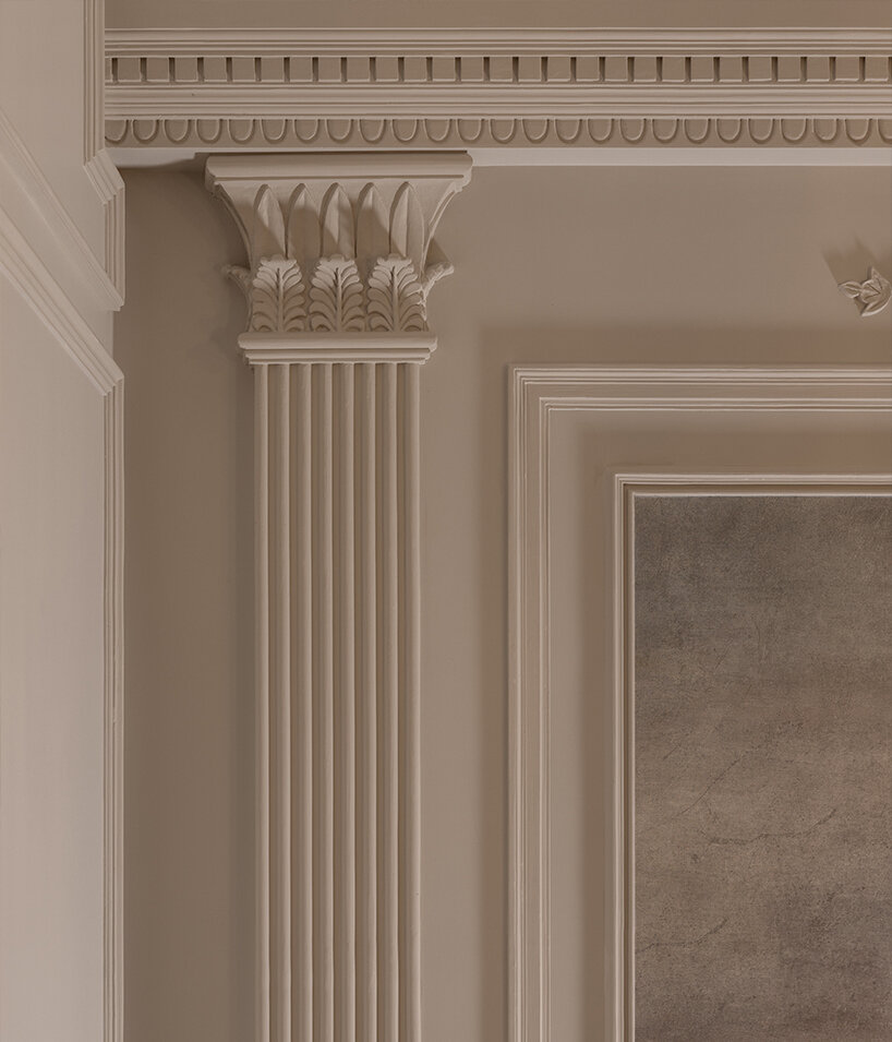 a close-up of a sculpted Greek pillar reveals the meticulous attention to neoclassical proportions