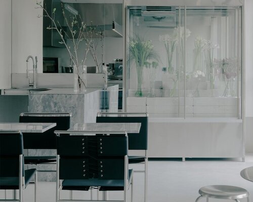 stainless steel and concrete build futuristic backdrop for tbilisi flower shop and cafe