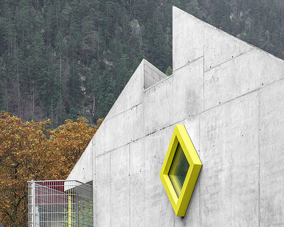 yellow diamond windows pierce angular concrete staff house by bergmeisterwolf in italy