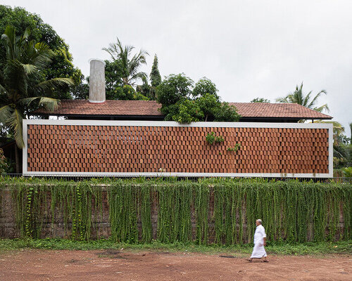 zero studio’s haven house features tropical gardens enclosed by breezy brickwork