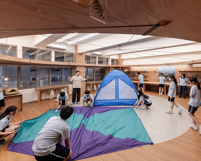 317studio transforms taiwan classroom into forest-like learning space for scouting education