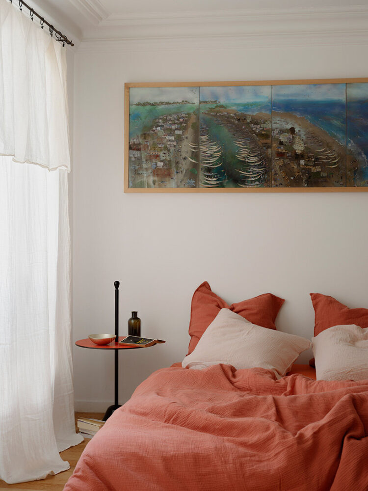 the bedroom introduces warmer tones and softer textures