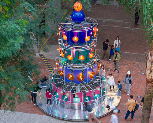 cake-like layers stack into a shared motion installation in china, bringing strangers into sync