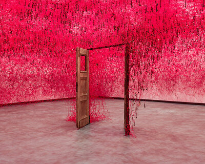 chiharu shiota's woven webs meet yin xiuzhen's clothing installations at hayward gallery
