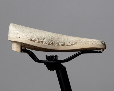 compostable bicycle seat takes shape as mycelium grows around the wooden saddle