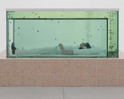 dreamlike aquarium of ‘kissing fish’ becomes a chamber to lie within