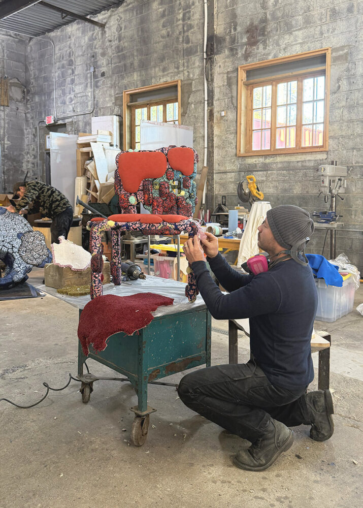Jack Craig at work on Rust Molded Carpet Chair in his Detroit studio
