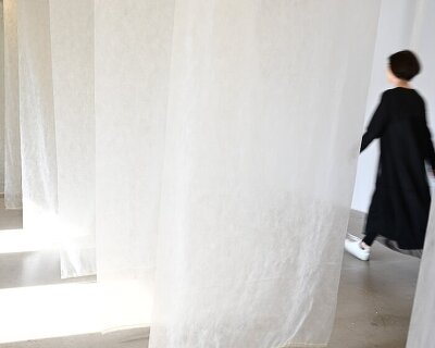 artwork uses floating fabric corridor and bodily movement to visualize climate change