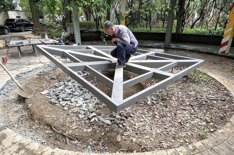 the steel structure during construction, showing the radial beam framework before panel installation