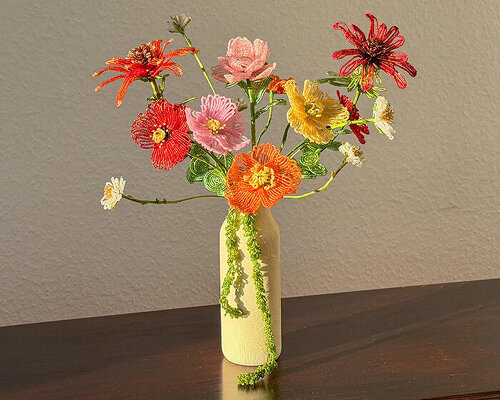 thousands of glass beads form delicate blossoms that never wilt in henri purnell’s sculptures