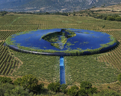 UFO-like winery by 314 architecture studio appears half buried in greek vineyards