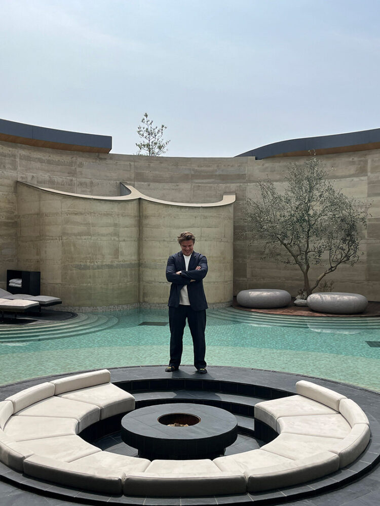 Bjarke Ingels stands at the circular firepit of villa '270'