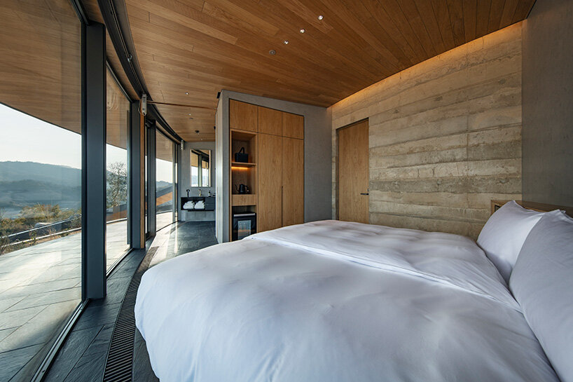 rammed earth walls meet warm timber joinery
