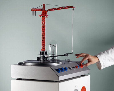 a bright red crane drives the needle in love hultén's reimagined vinyl player