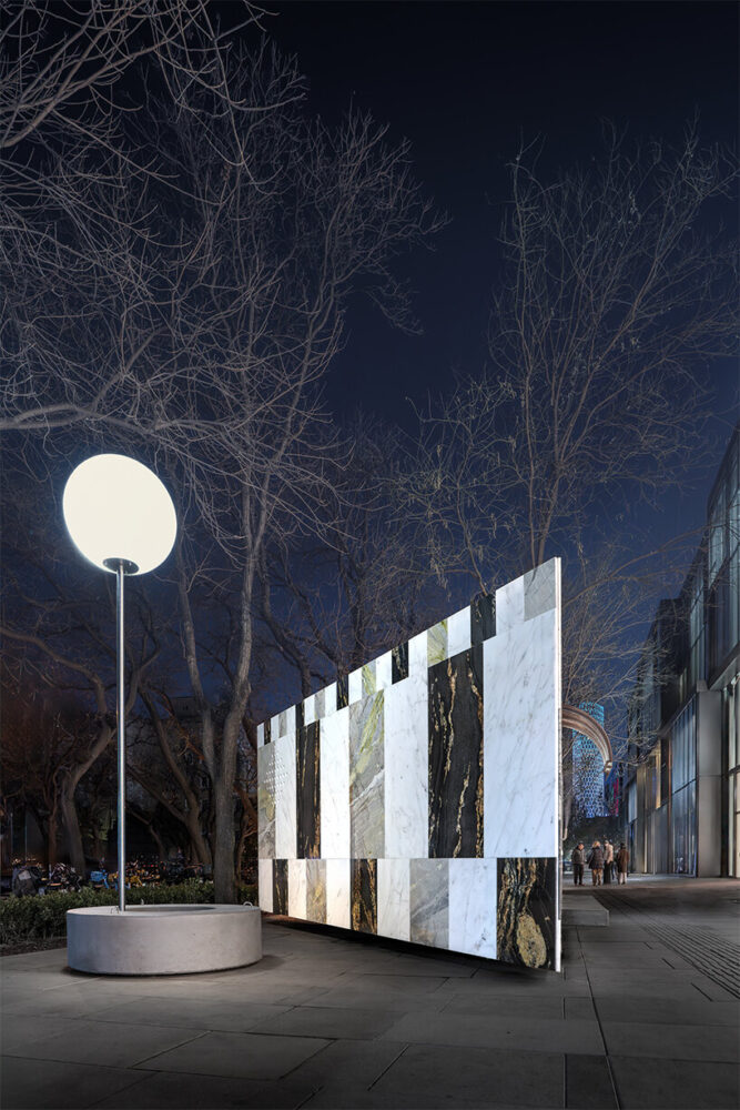 this piece of street furniture rises like a lamppost from a textured circular concrete bench