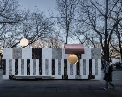 three-toned marble facades clad floating kiosk in beijing’s urban fabric