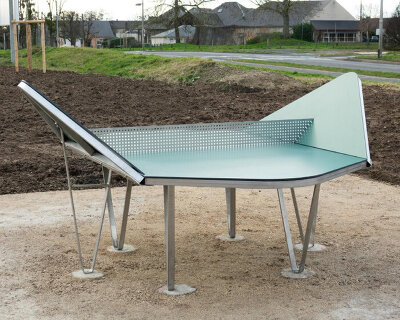 geometric ping pong tables stand as interactive public sculptures inside park in france