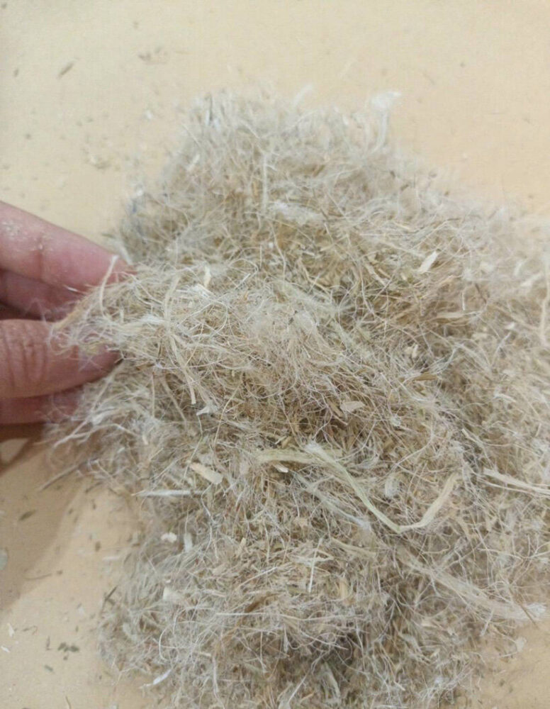 pineapple leaf fiber from discarded pineapple leaves is processed into felt, forming the core of the chair’s composite