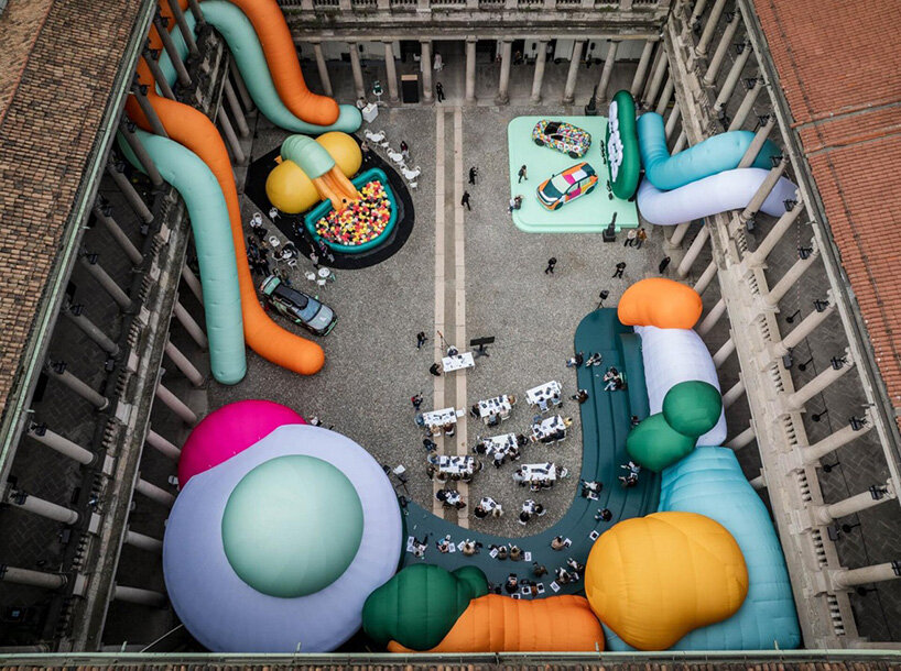 inflatable clay-like landscape by ulises studio fills palazzo del senato in milan with color - 3