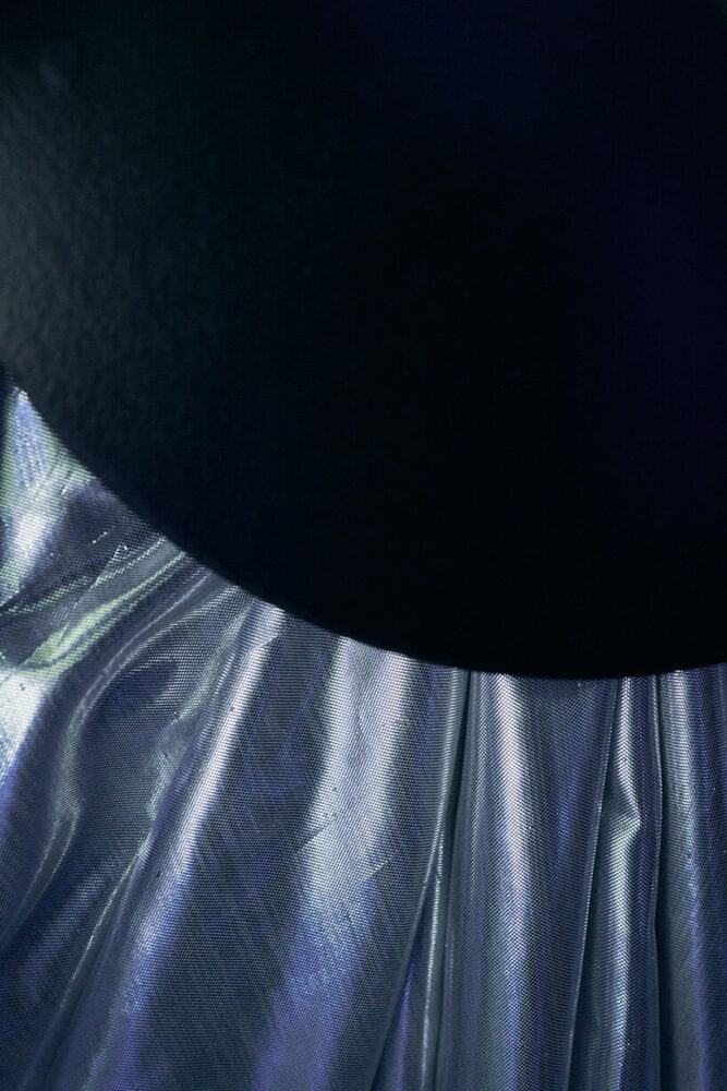 circular anchor points gather the material into precise drapes