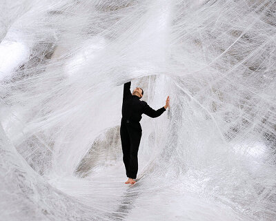 stepping inside numen / for use's ethereal spaces sculpted from tape and tensioned nets
