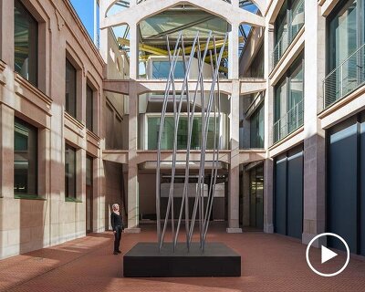 sixteen rotating vertical slats choreograph shifting forms in SpY’s kinetic sculpture