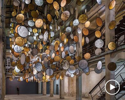 SpY’s kinetic installation suspends rotating gold and silver halos inside florence atrium