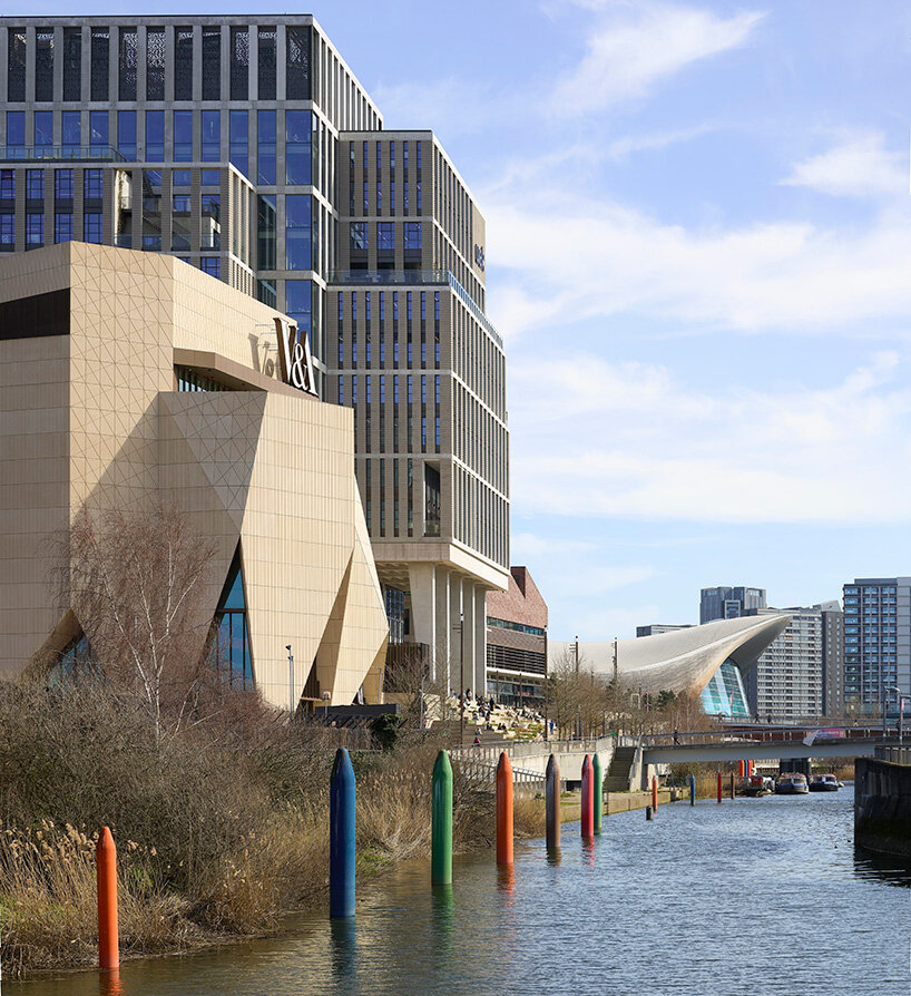 the folded facade appears as a sculptural volume within Stratford’s evolving urban fabric