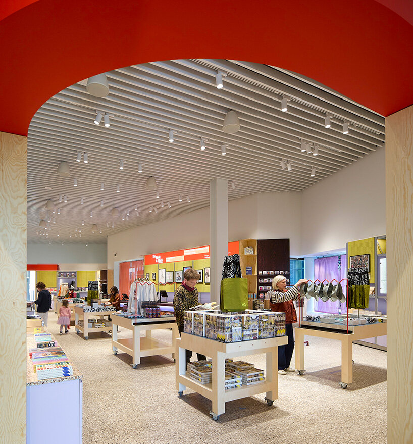 a bold red arch frames the museum shop