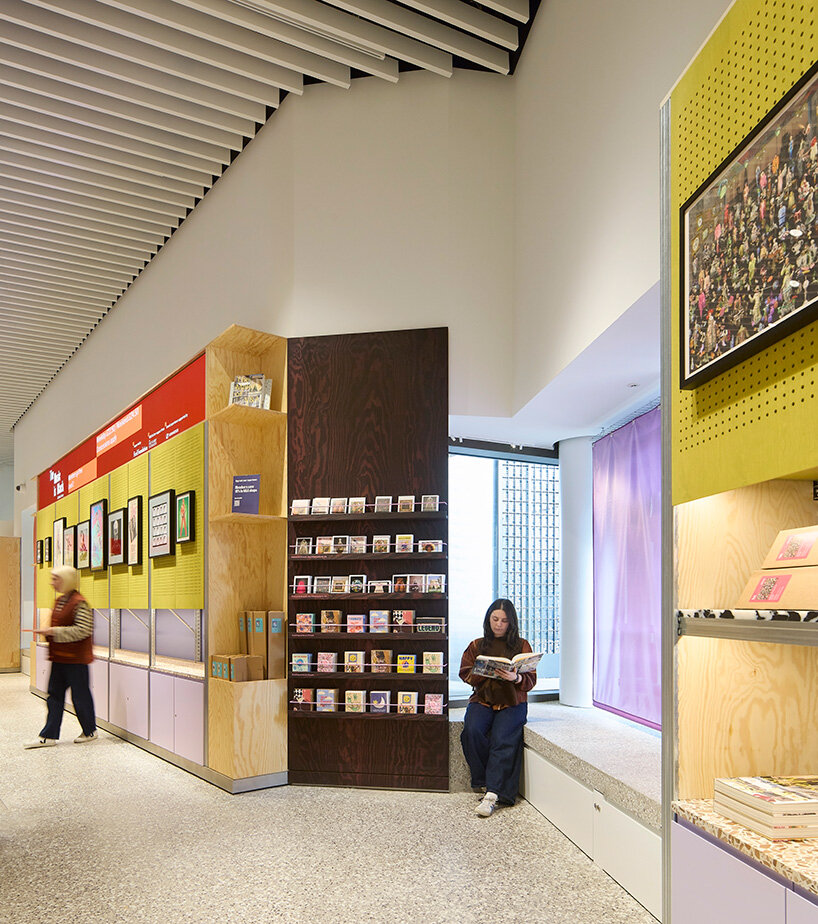 colorful suspended elements introduce moments of play within the otherwise restrained interior palette