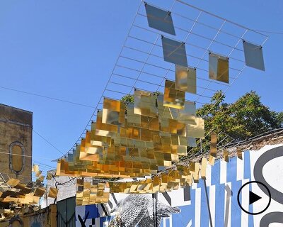 kinetic mirrored installation in portugal by moradavaga evokes a shoal of golden fish