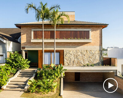 lima house carves open living spaces around a tropical garden in são paulo