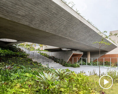 layered concrete facades and tropical vegetation shape maya tower by perkins&will in brazil