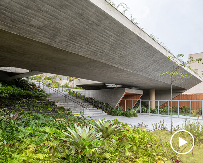 layered concrete facades and tropical vegetation shape maya tower by perkins&will in brazil