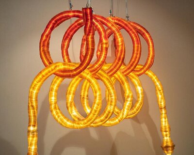 seaweed-based biodegradable material shapes two interlocking tubular light installations
