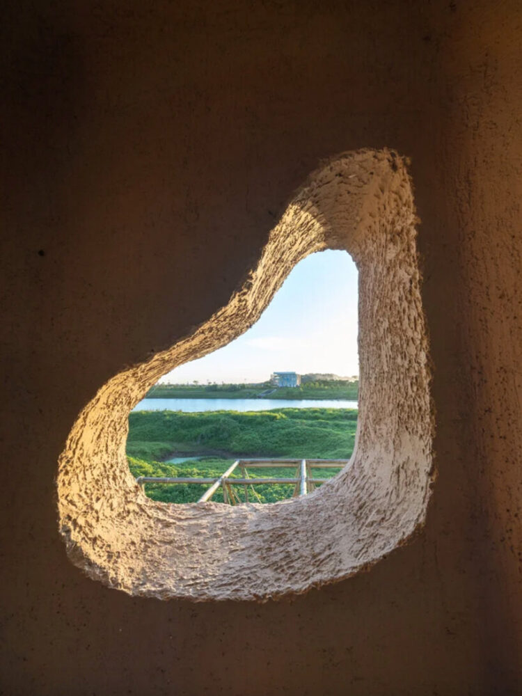 natural ventilation and framed wetland views are integrated into the structure