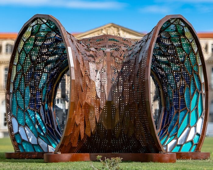 486 hand-folded metal panels shape origami tribute to mediterranean sea in marseille