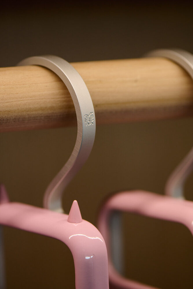 custom hangers feature Urban Sophistication’s signature logo as a recurring detail