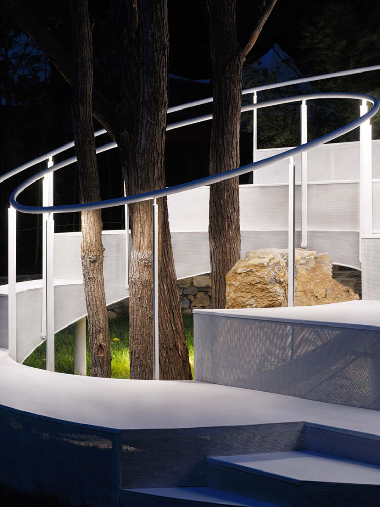 the installation is illuminated by nighttime lighting