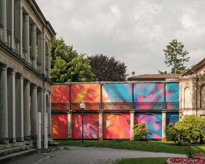colorful printed textile installation reimagines historic laundry building facade in switzerland