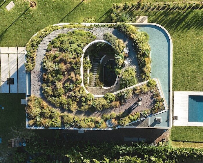 rooftop garden crowns concrete house in argentina shaped by spiraling patios