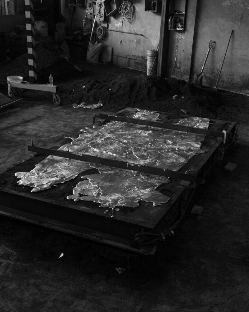 the casting process behind the Exhuma Dining Table, using a hand-made sand mold to shape the aluminum