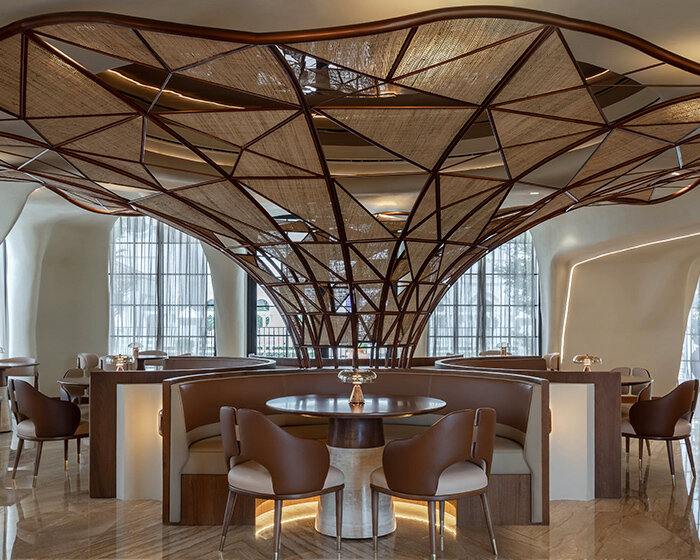 falwa restaurant transforms arabian equestrian heritage into fluid architectural interior